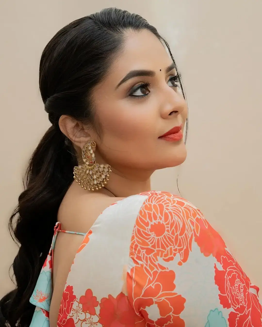 Beautiful Indian Actress Sreemukhi in Orange Lehenga Choli